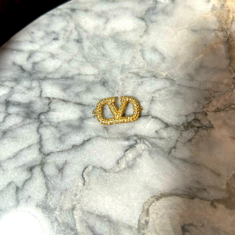 VALENTINO Gold Logo Charm - SO SHINY!